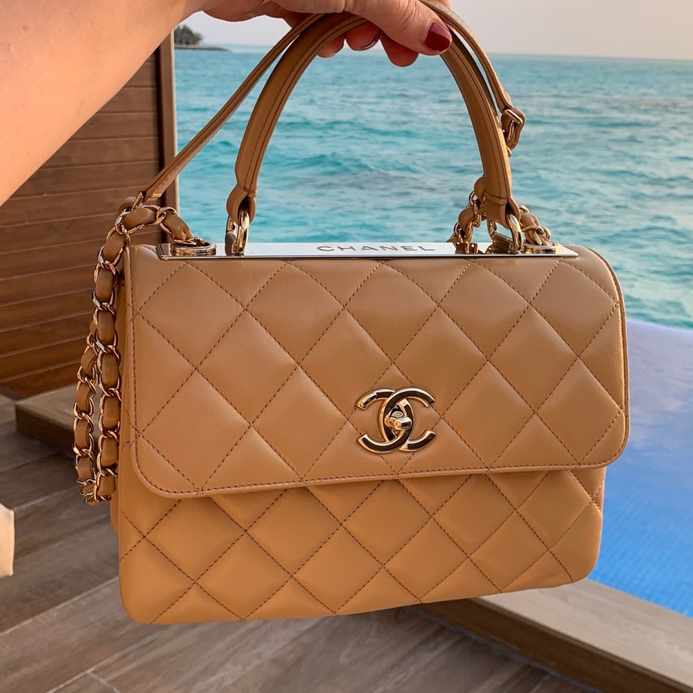 Authentic limited edition , rare nude larger Chanel purse with handle /stripe.